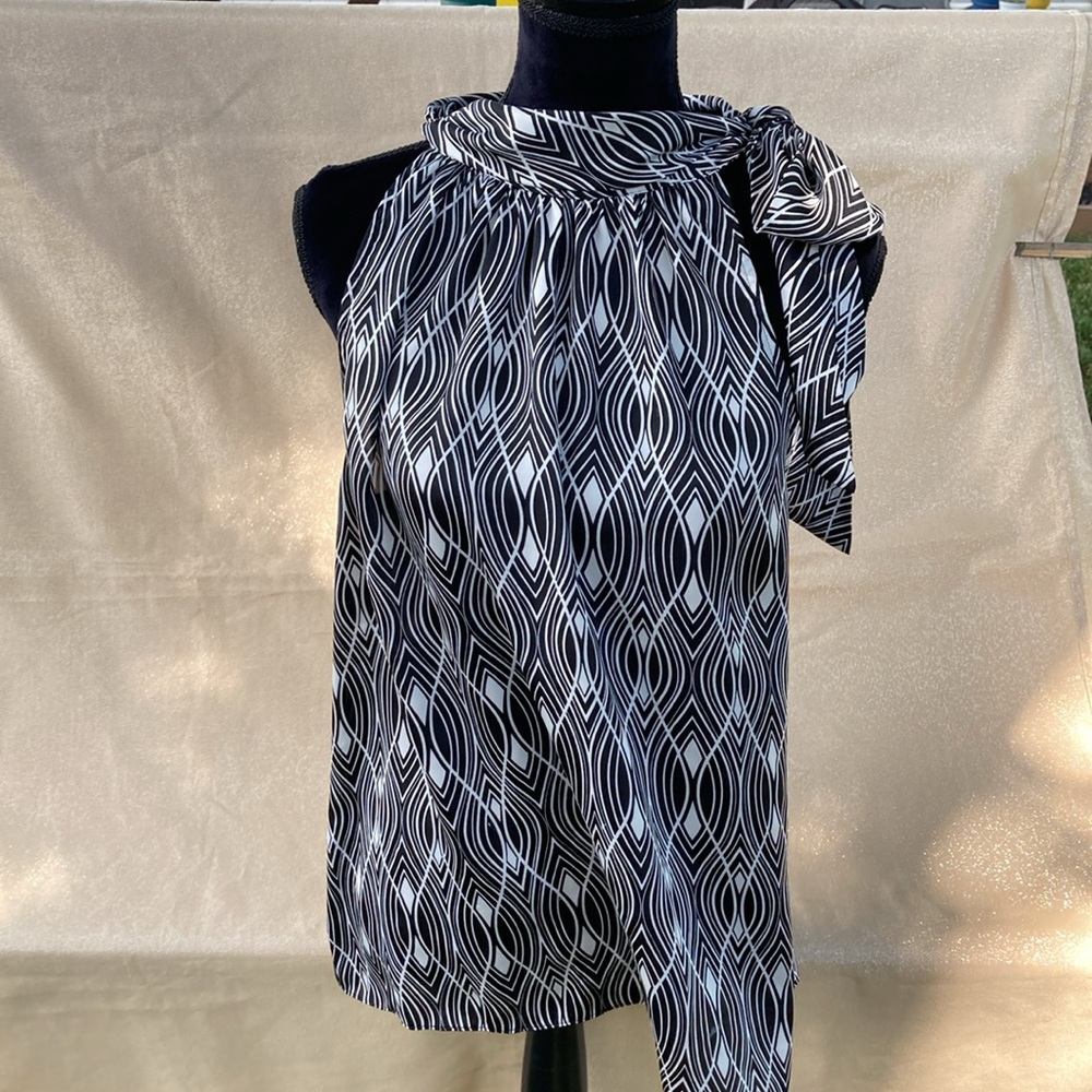 Ann Taylor LOFT open arm shirt.